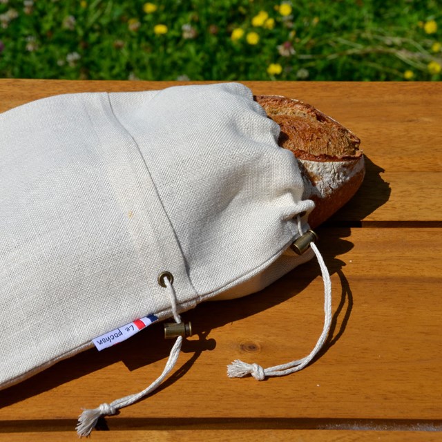 Sac à pain le pochon beige avec pain qui dépasse